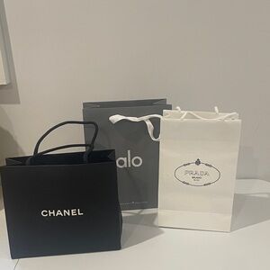 Chanel, Alo, and Prada Shopping Bags